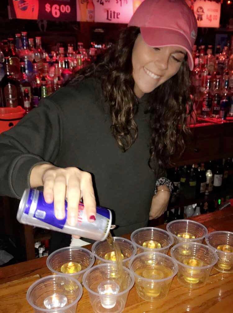 photo of bartender pouring Red Bull