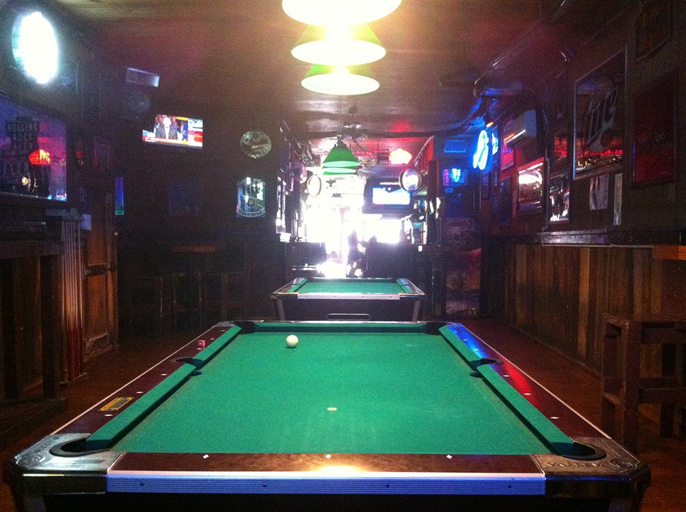 photo of 2 pool tables from upstairs in The CI