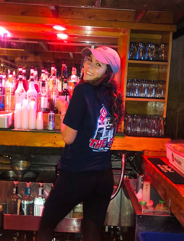 photo of girl working behind the bar