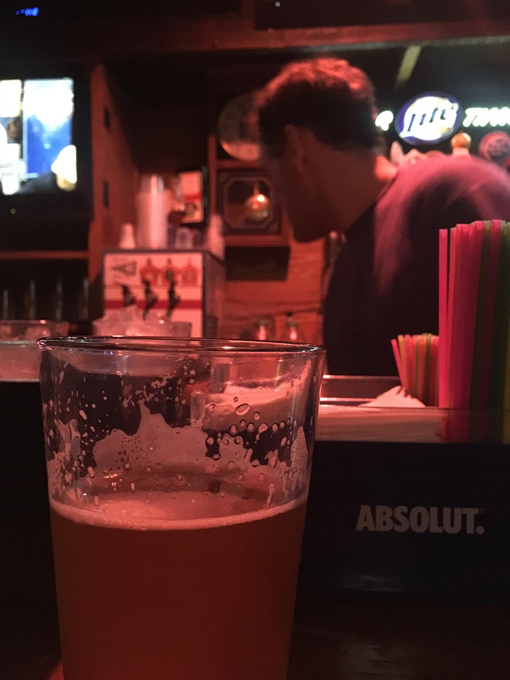 photo of beer at CI with bartender in the background