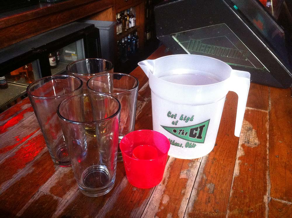 photo of empty glasses and pitcher on the bar